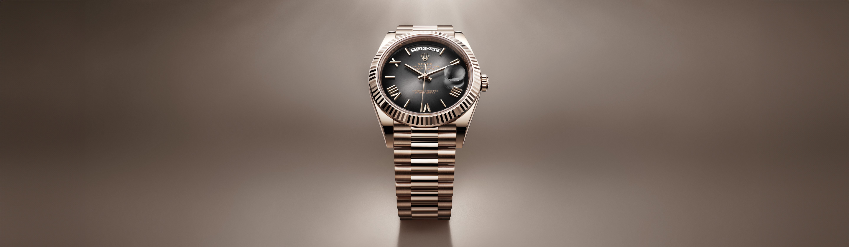 Banner Rolex Day-Date in Everose-Gold mit schwarzem Zifferblatt